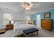 Spacious bedroom with panelling, natural light, and classic furniture at 118 Cavendish Ct, Hillsborough, NC 27278