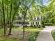Beautiful two-story home with a welcoming porch, black shutters, and driveway leading to the property at 118 Cavendish Ct, Hillsborough, NC 27278