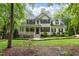Traditional home with a cozy front porch and well-manicured lawn at 118 Cavendish Ct, Hillsborough, NC 27278