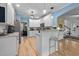 Modern kitchen with white cabinets, granite countertops, and stainless steel appliances, ideal for cooking at 118 Cavendish Ct, Hillsborough, NC 27278