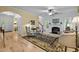 Cozy living room featuring a fireplace, hardwood floors, and elegant furnishings for comfortable living at 118 Cavendish Ct, Hillsborough, NC 27278