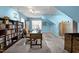 Brightly painted office space with built in bookshelves, desk, and storage cabinets at 118 Cavendish Ct, Hillsborough, NC 27278