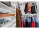 Organized walk-in closet with shelves, hanging rods, and ample storage space at 118 Cavendish Ct, Hillsborough, NC 27278