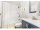 Clean bathroom showcasing a shower-tub combo, white subway tile, and a modern vanity at 119 Brookberry Cir, Chapel Hill, NC 27517