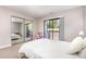 Bedroom featuring mirrored closet doors and a sliding glass door leading to the balcony at 119 Brookberry Cir, Chapel Hill, NC 27517