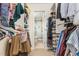 Walk-in closet providing ample storage space, with shelves, hanging rods, and access to the ensuite bathroom at 119 Brookberry Cir, Chapel Hill, NC 27517