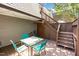 Outdoor deck with a table and chairs, with a staircase leading to the second floor at 119 Brookberry Cir, Chapel Hill, NC 27517