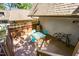 Outdoor deck with a table and chairs, enclosed by a wood railing with a bicycle, and green foliage at 119 Brookberry Cir, Chapel Hill, NC 27517
