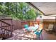 Outdoor deck with a table and chairs, enclosed by a wood railing, offering a secluded outdoor space at 119 Brookberry Cir, Chapel Hill, NC 27517