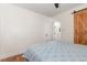 Bedroom with wood flooring, a barn door, and an interior door leading to another room at 1209 Lanark Ct, Cary, NC 27511
