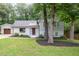 Charming exterior with a manicured lawn and mature trees, offering great curb appeal at 1209 Lanark Ct, Cary, NC 27511