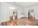 Living space offers an open-concept design with hardwood floors and fresh paint, seamlessly flowing to the kitchen at 1209 Lanark Ct, Cary, NC 27511