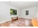 Living room showcasing natural light, neutral walls, and beautiful hardwood floors, creating a serene atmosphere at 1209 Lanark Ct, Cary, NC 27511