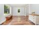 Sun-filled living room boasts beautiful hardwood floors, neutral walls, and an open layout for modern living at 1209 Lanark Ct, Cary, NC 27511