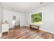 Living area featuring hardwood floors and fresh paint, enhanced by ample natural light and a modern, open layout at 1209 Lanark Ct, Cary, NC 27511