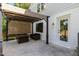 Inviting patio with a pergola, outdoor seating, string lights, and view of the lush backyard at 1209 Lanark Ct, Cary, NC 27511