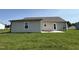 Exterior backyard with siding, patio and grass, perfect for outdoor entertaining at 128 Coharie Dr, Lillington, NC 27546