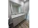 Bathroom featuring double vanity with granite countertop and view into other rooms at 128 Coharie Dr, Lillington, NC 27546