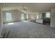 Open-concept floor plan showcasing a living area, kitchen, and dining space with ample natural light and modern finishes at 128 Coharie Dr, Lillington, NC 27546
