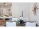 Dining room with seating for four, leading into a view of a modern kitchen with breakfast bar at 1309 Hudson Ave # D12, Durham, NC 27705