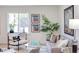 Well-lit living room showcasing stylish furniture and large window at 1309 Hudson Ave # D12, Durham, NC 27705