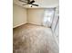 Bedroom features carpet flooring, white walls, natural light, and a ceiling fan at 141 Jones Franklin Rd # G, Raleigh, NC 27606