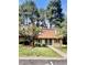 Inviting exterior featuring lush landscaping and a charming facade at 141 Jones Franklin Rd # G, Raleigh, NC 27606