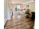 View of the living room with wood flooring and plenty of natural light at 141 Jones Franklin Rd # G, Raleigh, NC 27606