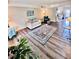 Spacious living room with wood floors, sofa, and modern decor at 141 Jones Franklin Rd # G, Raleigh, NC 27606
