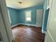 Bright bedroom with hardwood floors and natural light at 1525 Hargrove St, Rocky Mount, NC 27801