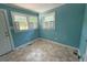 Light-filled room with vinyl floors, windows, and door at 1525 Hargrove St, Rocky Mount, NC 27801