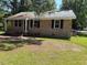 A charming brick home with a well-maintained lawn and inviting front porch at 1525 Hargrove St, Rocky Mount, NC 27801