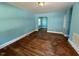 A large living room features wood floors and a view to an adjoining room at 1525 Hargrove St, Rocky Mount, NC 27801