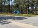 Community playground featuring play structures with mature trees surrounding the area at 1525 Hargrove St, Rocky Mount, NC 27801