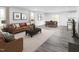 Spacious living room with modern furniture, including a comfortable sofa, stylish armchairs, and elegant decor at 1541 Ivy Meadow Ln, Zebulon, NC 27597