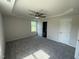 Spacious bedroom features a tray ceiling with fan, neutral walls, and soft carpeting at 166 Coharie Dr, Lillington, NC 27546