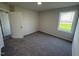 Cozy bedroom with plush carpeting, neutral walls, and a bright window for natural light at 166 Coharie Dr, Lillington, NC 27546