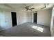 Spacious bedroom features neutral walls, soft carpeting and multiple doorways at 166 Coharie Dr, Lillington, NC 27546