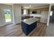 Modern kitchen with granite countertops, stainless steel appliances, and a central island at 166 Coharie Dr, Lillington, NC 27546
