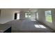 Bright, open living room with plush carpet, neutral walls, and large windows allowing natural light at 166 Coharie Dr, Lillington, NC 27546