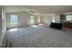 Bright, open living room leads to the kitchen area with an island and modern finishes at 166 Coharie Dr, Lillington, NC 27546