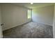 Neutral bedroom with gray carpet and a window offering plenty of natural light at 179 Coharie Dr, Lillington, NC 27546