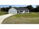 Charming single-story home featuring a classic white facade, a two-car garage, and a neatly maintained lawn at 179 Coharie Dr, Lillington, NC 27546