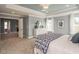 Comfortable main bedroom showcasing neutral paint, tray ceilings, and plush carpeting at 2014 Cross Bones Blvd # 30, Durham, NC 27703