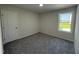Bedroom featuring plush carpeting, bright window with an exterior view at 206 Coharie Dr, Lillington, NC 27546