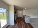Stylish kitchen with granite counters, modern cabinets, recessed lights, and wood-look floors at 206 Coharie Dr, Lillington, NC 27546