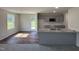 Modern kitchen featuring granite countertops, stainless steel appliances, and wood-look floors at 206 Coharie Dr, Lillington, NC 27546