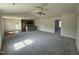 Spacious living room with new carpet, vaulted ceiling, and an adjacent kitchen area at 206 Coharie Dr, Lillington, NC 27546