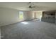 Open-concept living room with new carpet, recessed lights, and easy access to the kitchen at 206 Coharie Dr, Lillington, NC 27546
