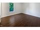 A bedroom shows wood-look flooring, neutral walls, and white trim at 216 E Hinton St, Clayton, NC 27520